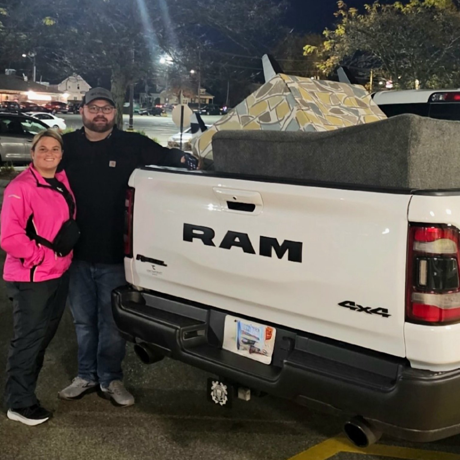 Customer loading new couch in truck